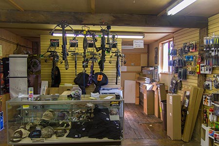 The Straight Arrow Archery sales counter and gear wall