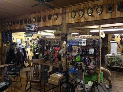 Wall of archery accessories at Straight Arrow Archery